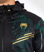 Load image into Gallery viewer, UFC Adrenaline by Venum Authentic Fight Night Men’s Walkout Hoodie - Emerald Edition - Green/Black/Gold
